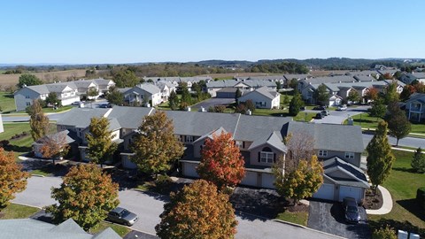 an aerial view of a neighborhood with houses and trees