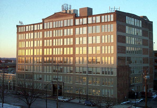 a large building with the sun shining in the windows