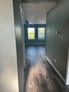 A hallway with a door at the end.