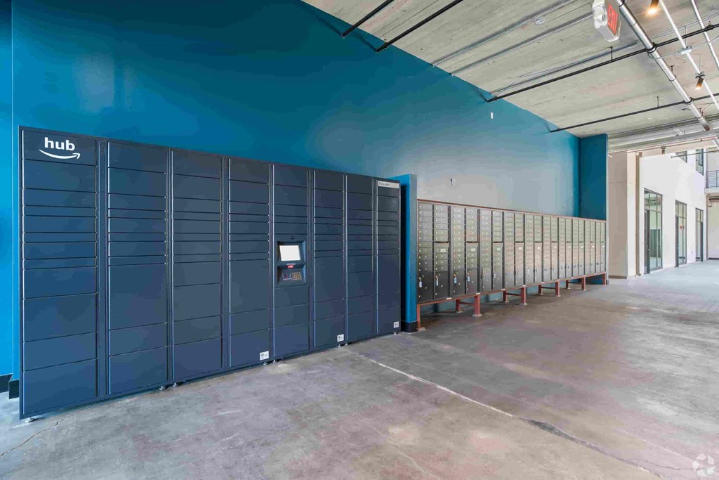 a row of lockers in a room with a blue wall