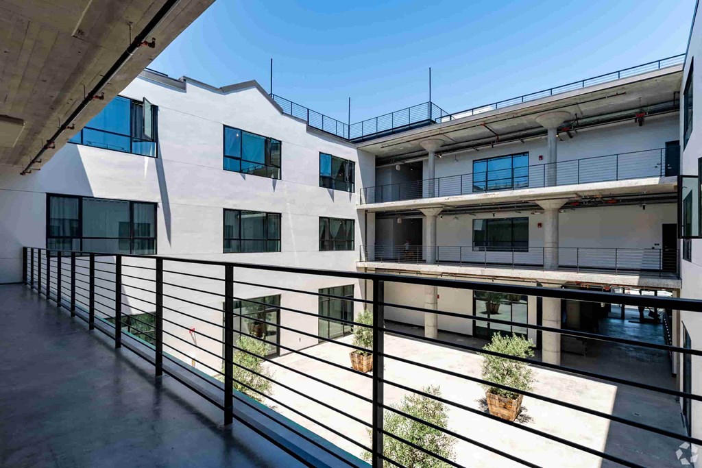 the view from the balcony of an apartment building