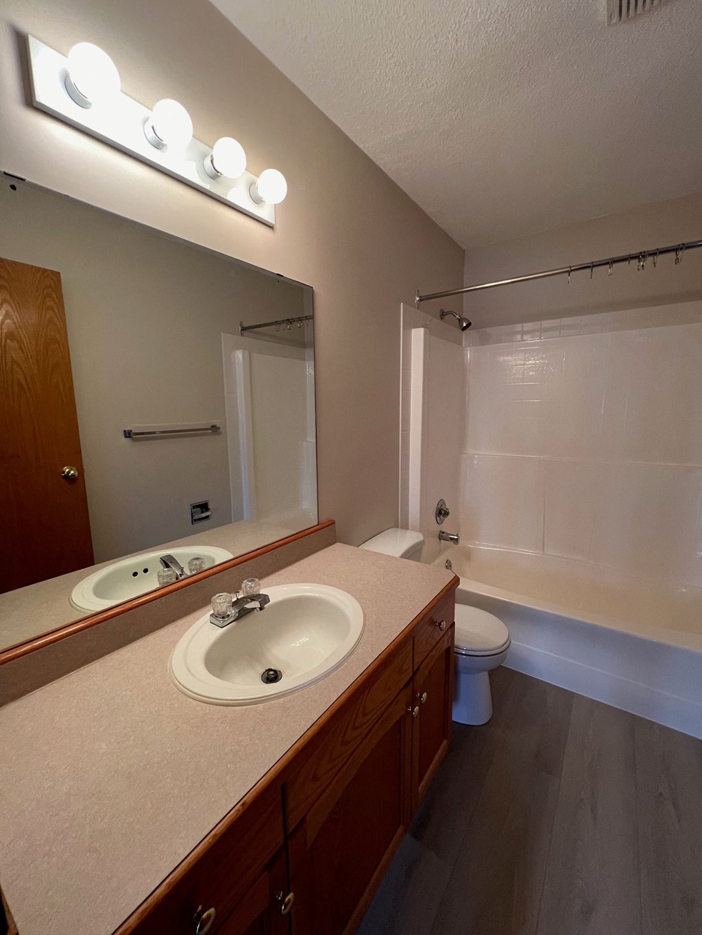 a bathroom with a sink and a toilet and a mirror