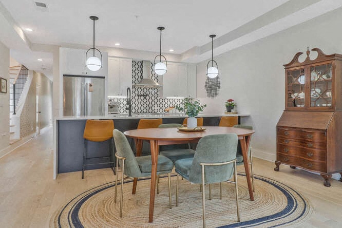 a dining room with a table and chairs