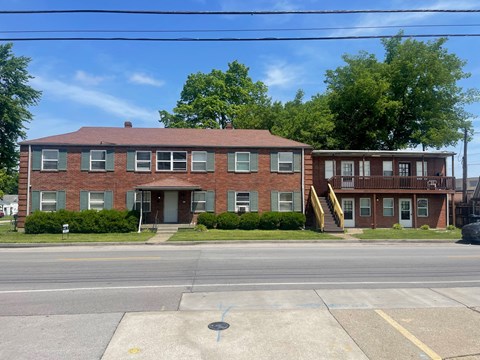 an apartment building on the corner of a street