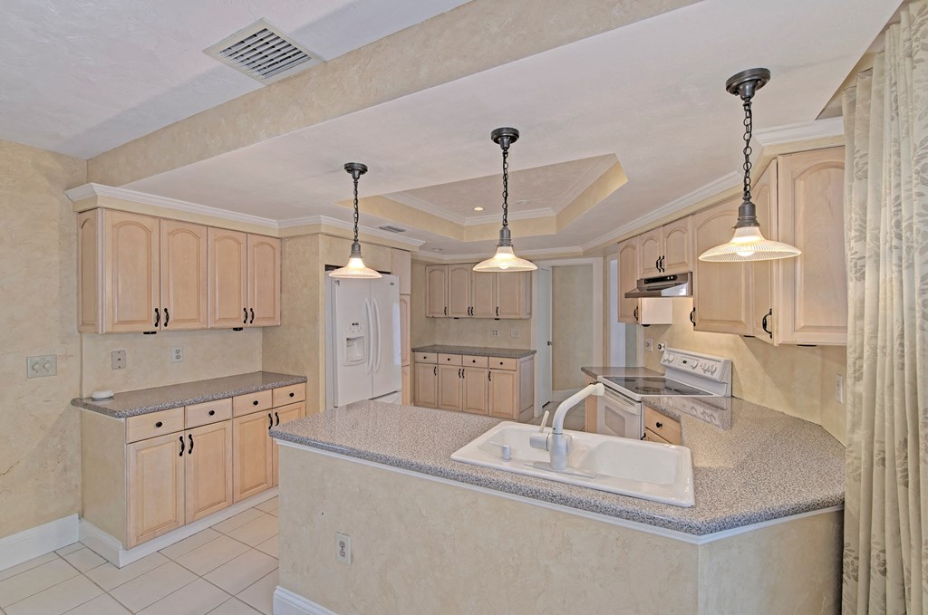 a kitchen with a sink and a counter top