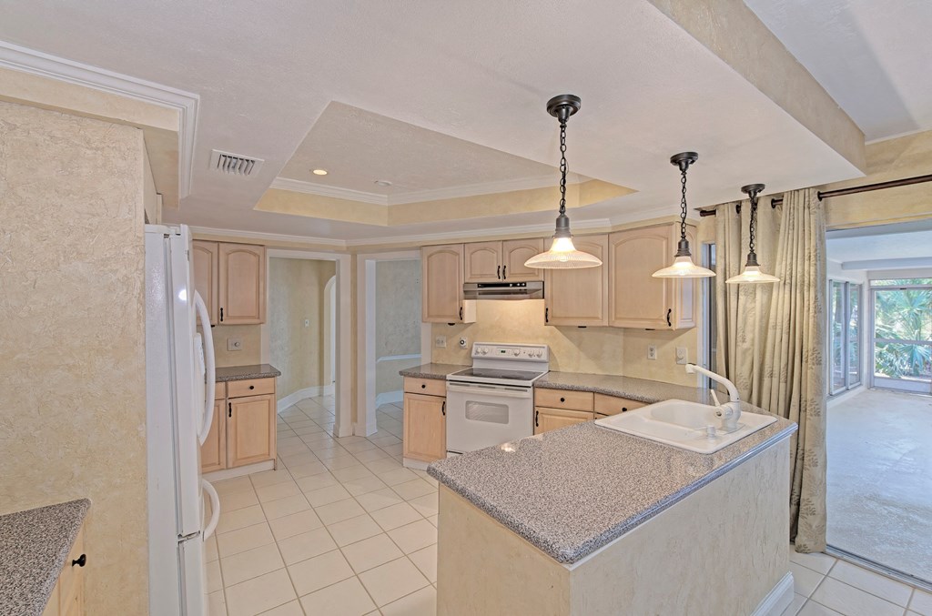 a kitchen with a sink and a counter top
