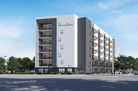 A modern apartment building with the name "The Parsonage" on the side.