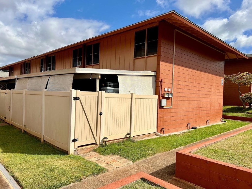 a house with a fence in front of it