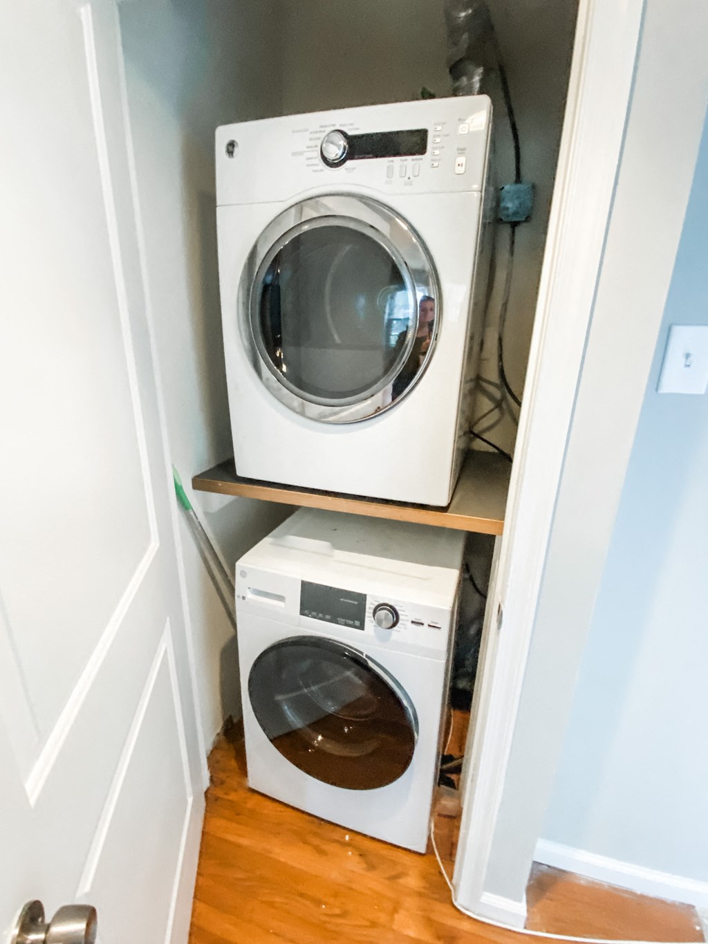 a small laundry room with a washing machine and a dryer