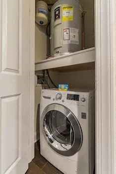 a washer and dryer in a small laundry room
