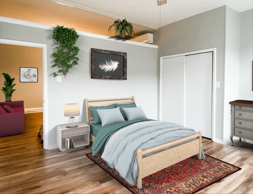 a bedroom with a bed and a rug