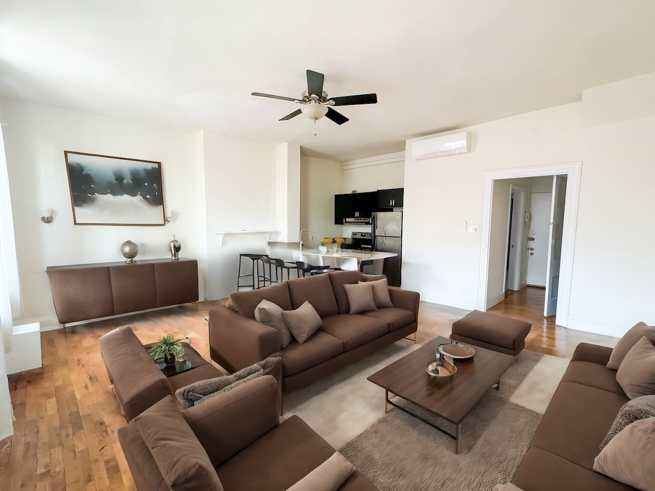 a living room with couches and a coffee table