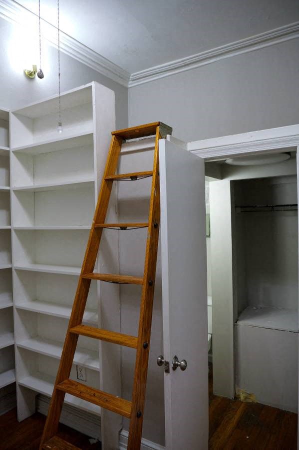 a ladder in a room with a closet