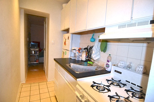a kitchen with a stove and a sink