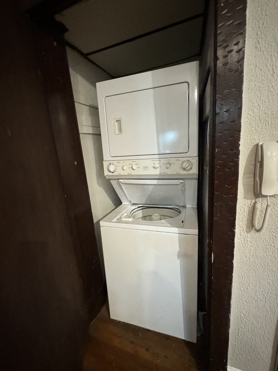 the washer and dryer in the bathroom of a hotel room