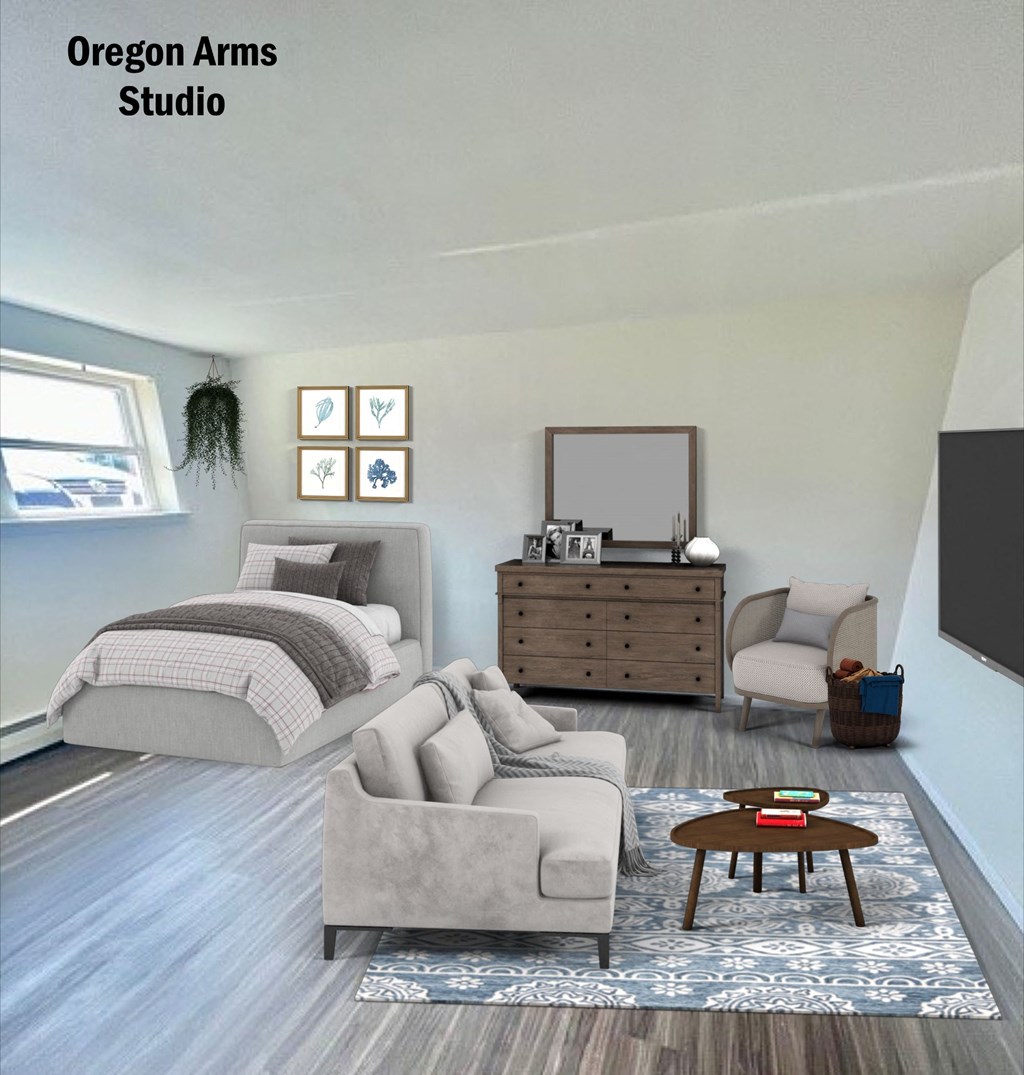 a living room with a couch and a chair and a bed