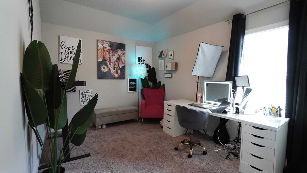 a home office with a desk and a computer