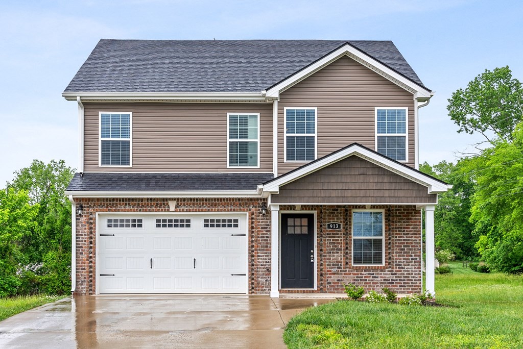 a house with a white garage door in front of it