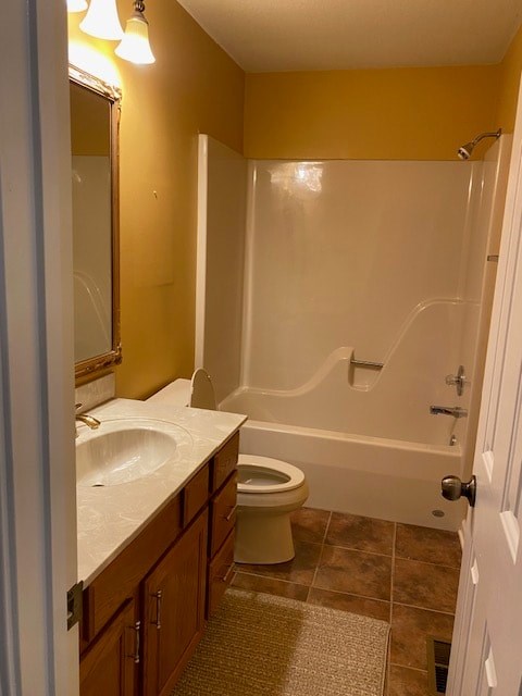 a bathroom with a toilet and a sink and a shower
