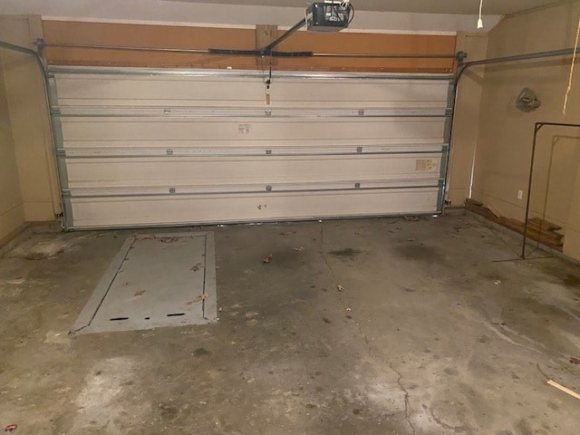 a garage door in a room with a cement floor