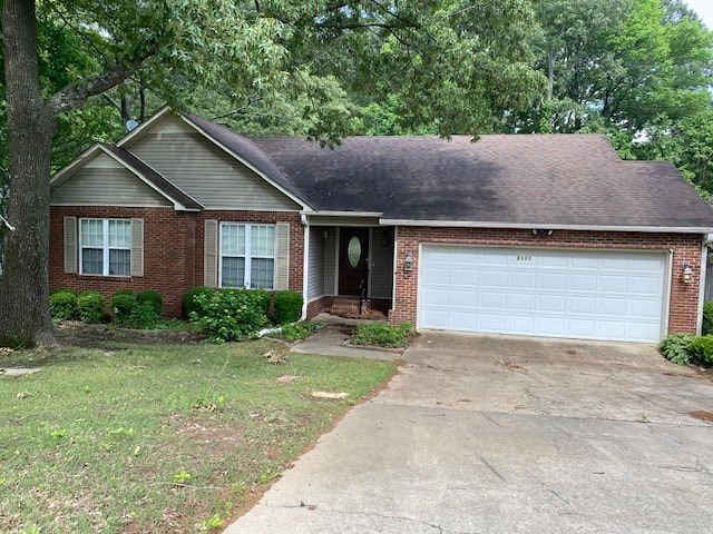 a brick house with a white garage door