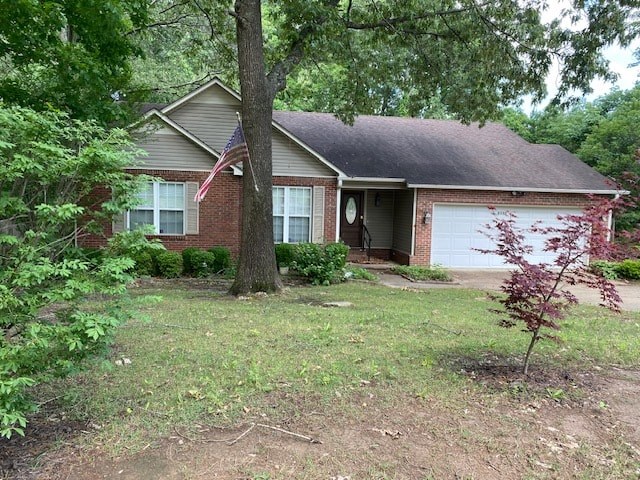 a house with a yard and a tree in front of it