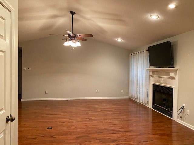 a empty living room with a ceiling fan and a fireplace