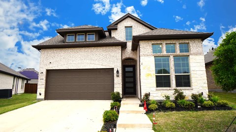 a house with a garage door in front of it