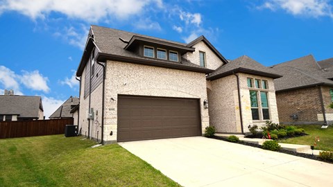 a garage door in front of a house