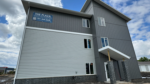 a building with a blue sign on the side of it