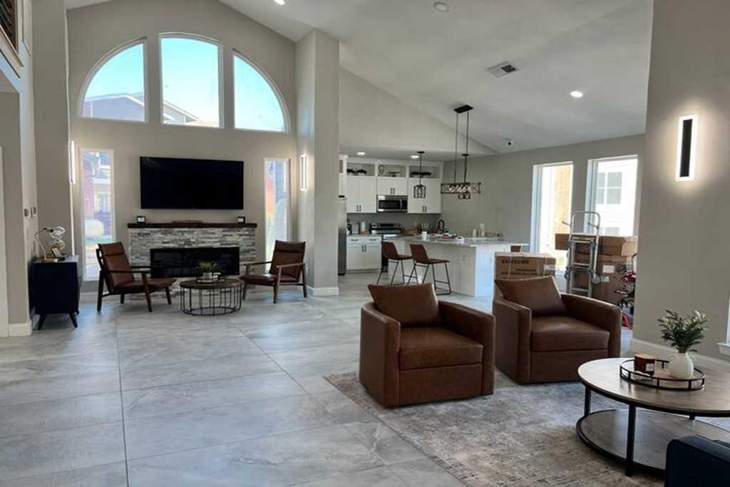 a large living room with furniture and a fireplace