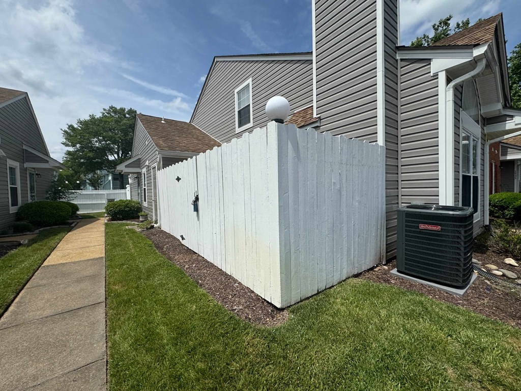 a privacy fence in front of a house