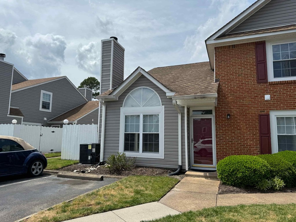 a house with a car parked outside of it