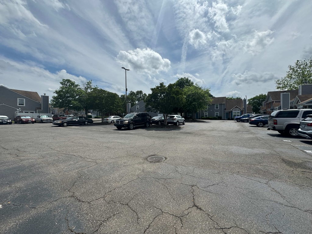 an empty parking lot with cars in a parking lot