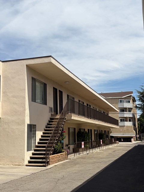A building with a staircase leading to the second floor.