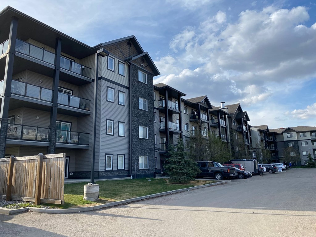 an apartment building on the side of a street