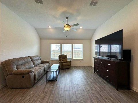 a living room with a couch and a tv