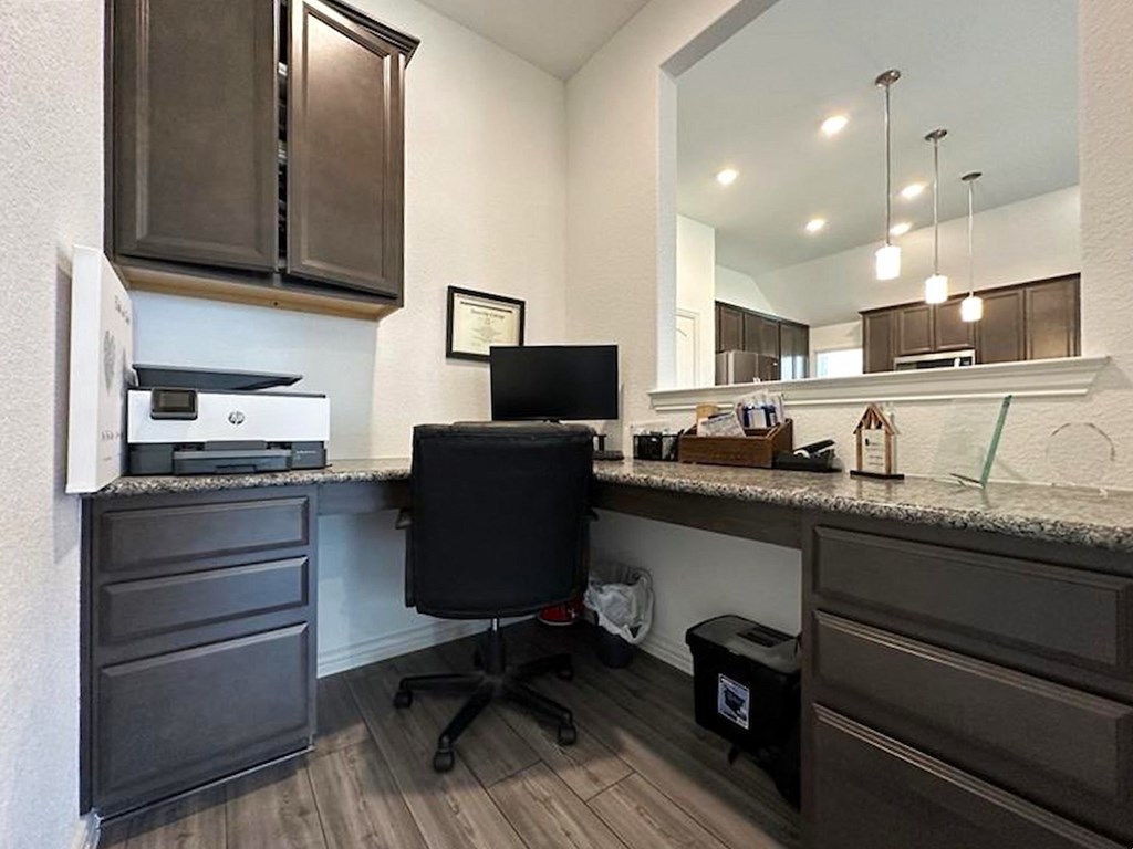 a home office with a desk and a computer