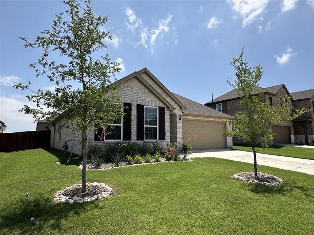 a house with two trees in the yard