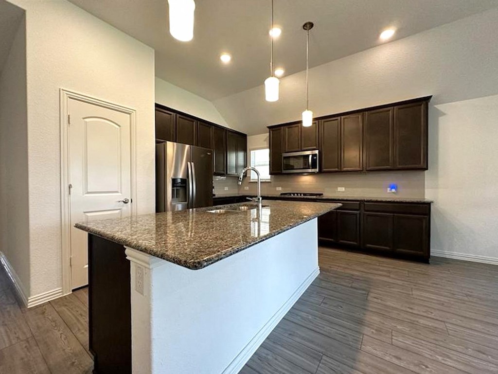 a kitchen with a granite counter top and