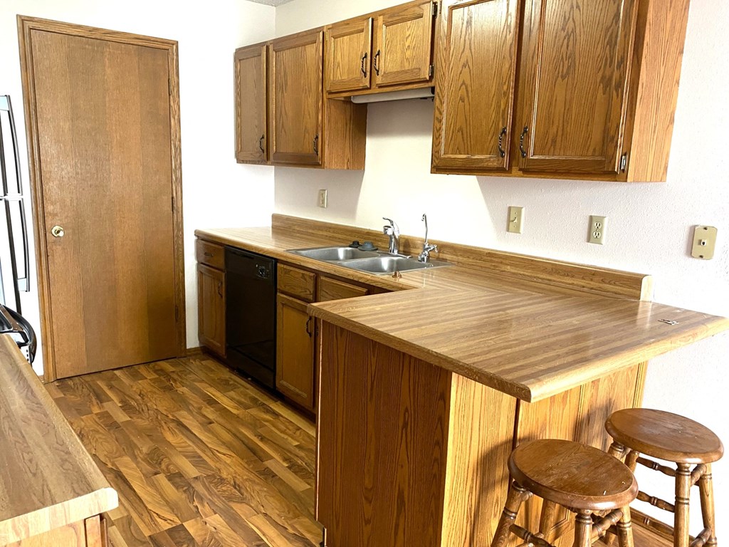 a kitchen with a counter top and a sink