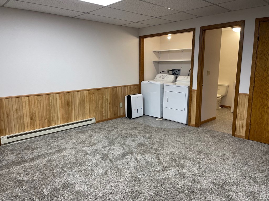 a room with a laundry room and a washer and dryer in it