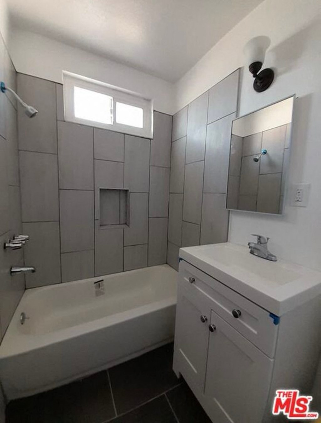 a bathroom with a sink and a bath tub