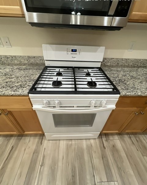 a white stove top oven in a kitchen