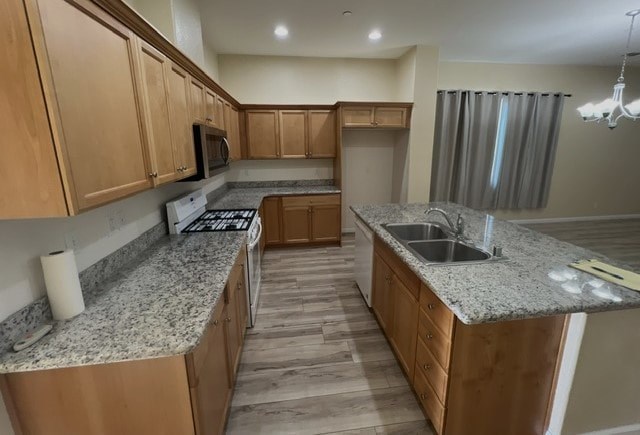 a kitchen with granite counter tops and wooden cabinets
