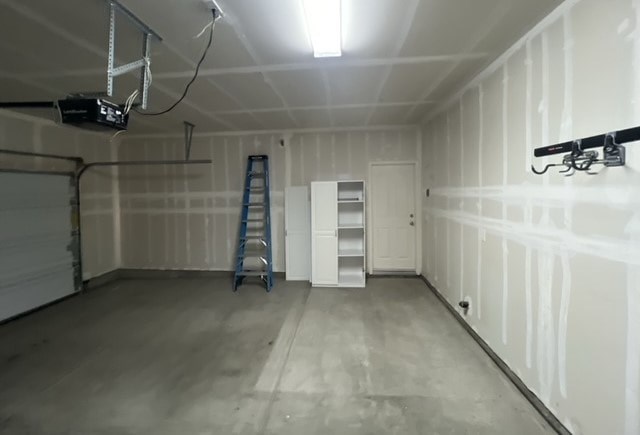 a room with a ladder and a white wall