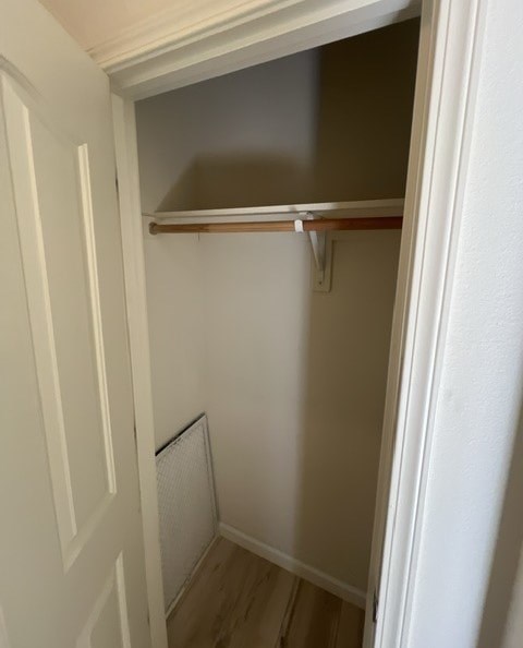 a small closet with a shelf in it