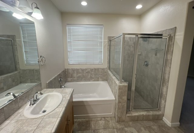 a bathroom with a tub and a sink and a shower