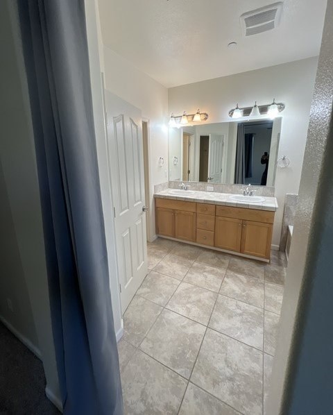 a large bathroom with a sink and a mirror