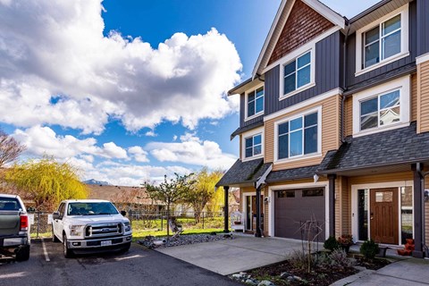 a house with a truck parked in front of it